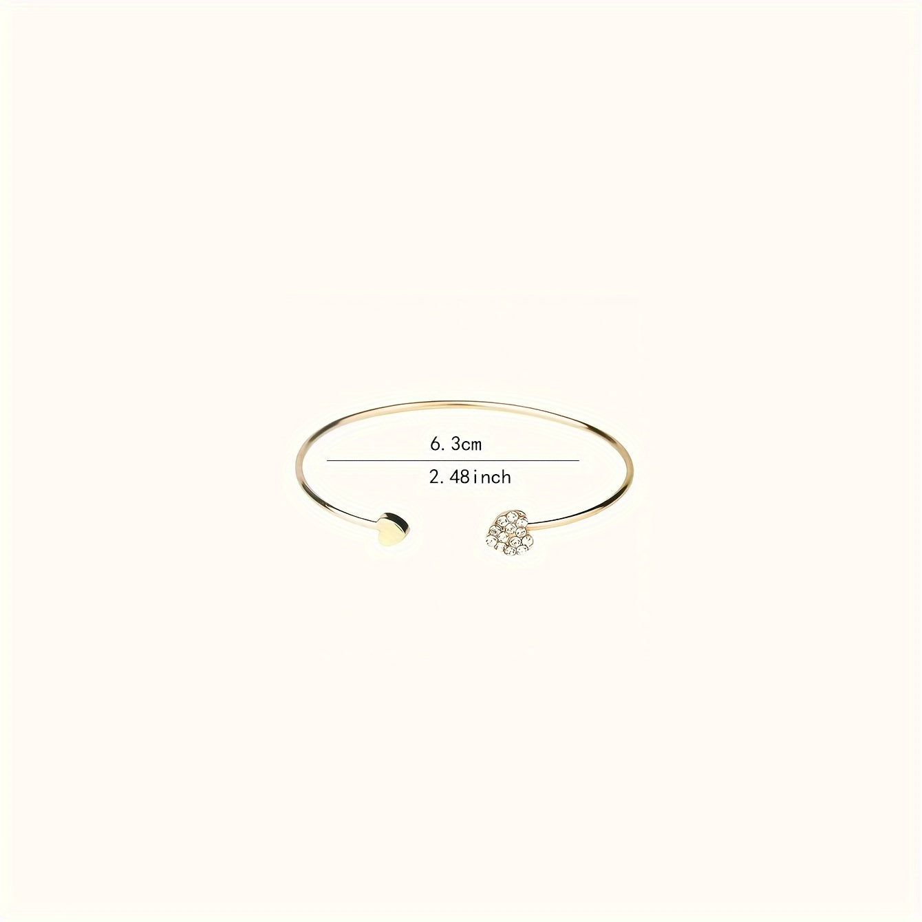 Bracciale Rigido Chic con Design a Cuore, Impreziosito da Strass Scintillanti
